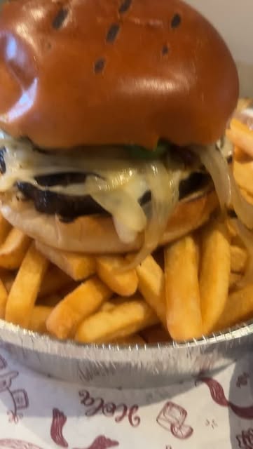 Cheeseburger with melted cheese and fries from Instagram