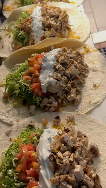 Three steak tacos with onion and cilantro from Instagram